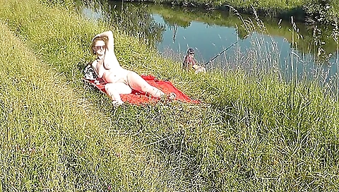 Wild Beach. Sexy Milf Platinum Naked Sunbathing On River Bank, Random Fisherman Guy Watches. Naked In Public. Nude Beach